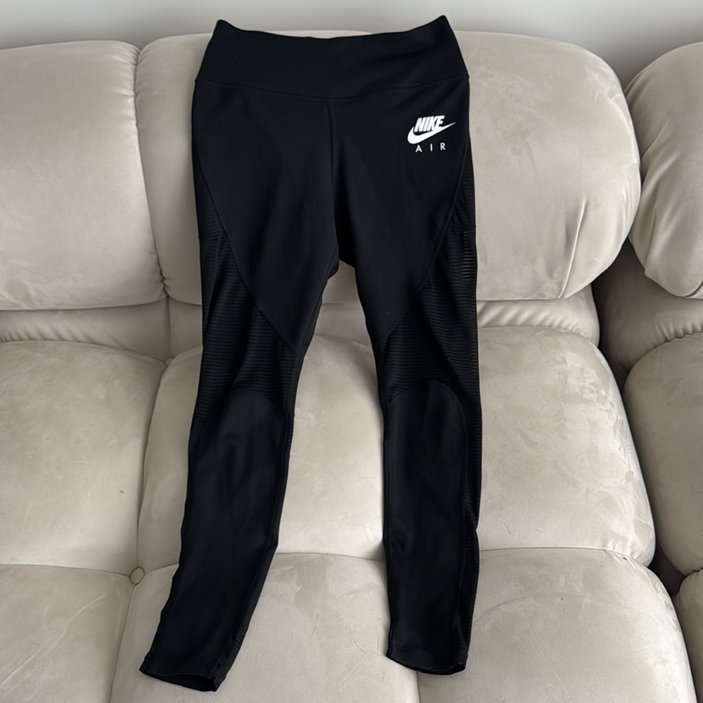 Nike women's tights with mesh detailing.